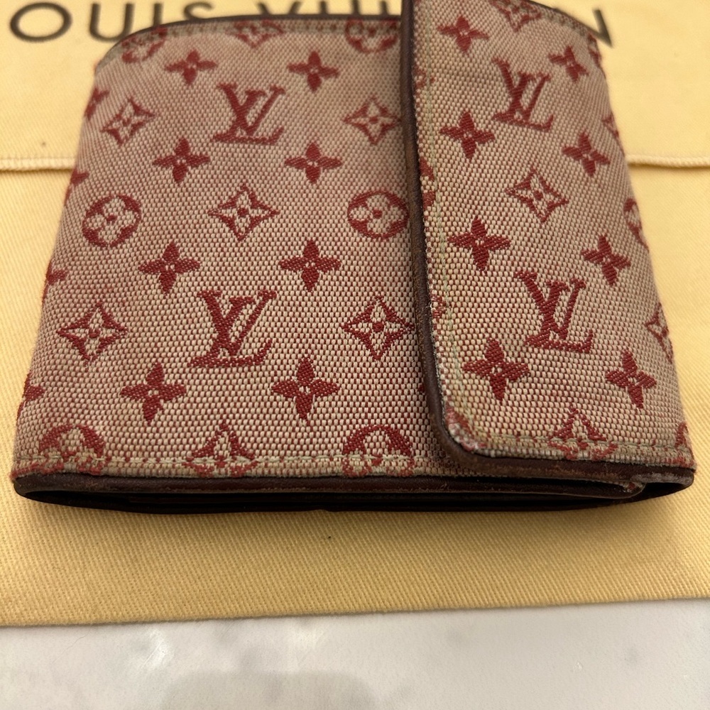 Louis Vuitton Pink and Red Wallet with Monogram Design